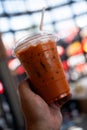 A cup of the ice thai milk tea with a plastic tube Royalty Free Stock Photo