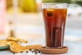 A cup of Iced Americano Coffee with ice cubes placed on a marble table in a coffee shop. Top view of a glass of coffee Royalty Free Stock Photo