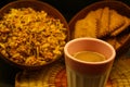 Cup of Indian Masala tea with snacks on black background. Royalty Free Stock Photo