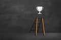 Cup on the ladder. success concept on blackboard