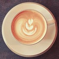 Cup of latte art coffee with retro filter Royalty Free Stock Photo