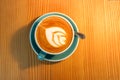 A cup latte art coffee on wood table Royalty Free Stock Photo