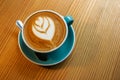 A cup latte art coffee on wood table Royalty Free Stock Photo