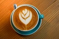 A cup latte art coffee on wood table Royalty Free Stock Photo