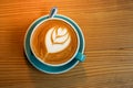 A cup latte art coffee on wood table Royalty Free Stock Photo