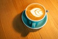 A cup latte art coffee on wood table Royalty Free Stock Photo