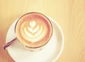 Cup of latte or cappuccino coffee with retro filter Royalty Free Stock Photo