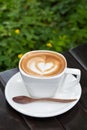 Cup of latte coffee on wood table (Selective focus) Royalty Free Stock Photo