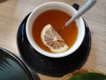 A cup of lemon tea, hot and reasy to drink with spoon Royalty Free Stock Photo