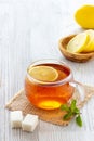 Cup of lemon tea on wooden table