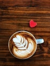 Cup of love , heart latte art coffee in white cup and red love heart Royalty Free Stock Photo