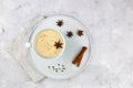 A cup of masala tea. Traditional Indian tea drink with milk and spices: cinnamon, anise, cardamom, nutmeg, pepper Royalty Free Stock Photo