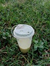 a cup of matcha drink on a grass background Royalty Free Stock Photo