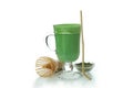 Cup of matcha latte and accessories for making isolated on white background Royalty Free Stock Photo