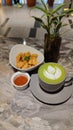 A Cup Of Matcha Latte And A Bowl Of Crunchy Friend Chicken Nugget With Chili Sauce