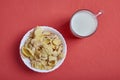 Cup of milk and corn flakes in white bowl Royalty Free Stock Photo