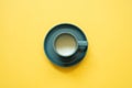 Cup of milk isolated on yellow background. top view, copy space, minimalism Royalty Free Stock Photo