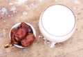 Cup of milk with ripe dates