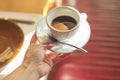 Cup with morning coffee in female hand Royalty Free Stock Photo