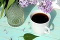 Cup of morning coffee on the table against a background of lilac