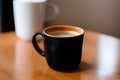 A cup of morning coffee on a wooden table generated by ai