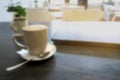 Cup mug of coffee, latte, cappuccino, laptop, remote distance work job on wooden table in city cafe, Blurred abstract Royalty Free Stock Photo