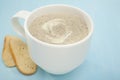 Mug of Mushroom Soup on Blue Background Royalty Free Stock Photo