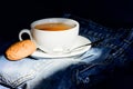 Cup mug hot tea and oat cookie. Mug filled tea close up. Herbal green or black whole leaf. Process tea brewing ceramic