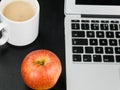 Cup of Mushroom Soup With a Red Apple and a Laptop Computer Royalty Free Stock Photo