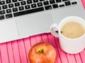 Cup of Mushroom Soup with a Red Apple and a Laptop Computer Royalty Free Stock Photo