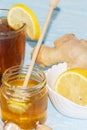 Cup of natural tea with ginger, lemon and honey on a light background. Healthy drink. The concept of a hot winter drink Royalty Free Stock Photo