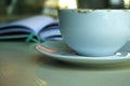 Cup and planer on the table in cafe