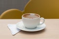 cup, plate and white napkins on a wooden table Royalty Free Stock Photo