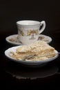 Crockery, cup and portion of Napoleon cake