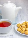 A cup of redbush tea with tiny shortbread cookies Royalty Free Stock Photo