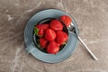 Cup with ripe red strawberries on table Royalty Free Stock Photo