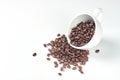 Cup with roasted coffee beans isolated on white background Royalty Free Stock Photo