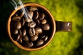 A cup of roasted coffee beans