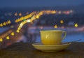 Cup and saucer with blurred colorful background