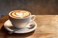 Cup on a saucer with cappuccino with a heart design on the table Royalty Free Stock Photo