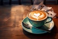 Cup on a saucer with cappuccino with a heart design on the table Royalty Free Stock Photo