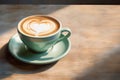 Cup on a saucer with cappuccino with a heart design on the table Royalty Free Stock Photo