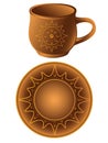 A cup and a saucer made of clay. Ceramic saucer and a cup in ethnic style. Pottery. Crockery with ornament. Solar symbols.
