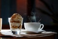 Cup, saucer, spoon and dessert in a glass Royalty Free Stock Photo