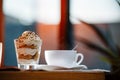 Cup, saucer, spoon and dessert in a glass Royalty Free Stock Photo