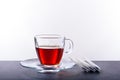 Cup and saucer with tea on a white background