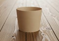 Cup sits on a wooden surface with visible grain patterns and natural Royalty Free Stock Photo