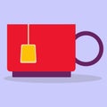 Cup. A small red mug with a tea bag. Royalty Free Stock Photo