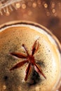 A cup of spiced coffee with anis star macro Royalty Free Stock Photo