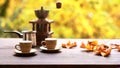 A cup of steaming coffee on a table against a background of yellow leaves. Autumn mood.